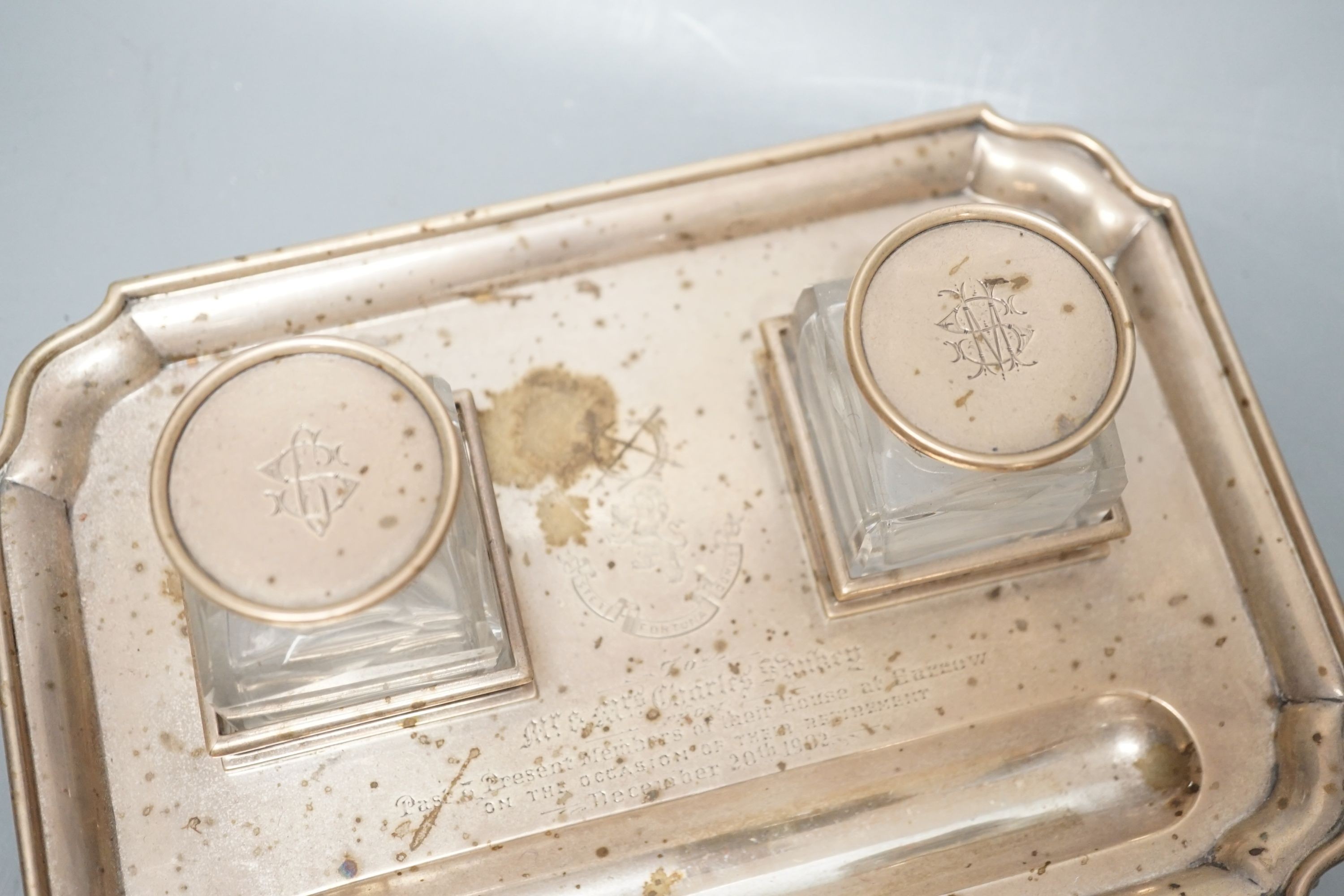 A presentation silver oval inkstand, with two mounted glass wells, William & John Barnard, London, 1884, ‘presented to Miss Ruby Streatfeild’, (a.f.),24.1cm and one other silver inkstand, Charles Stuart Harris, London, 1